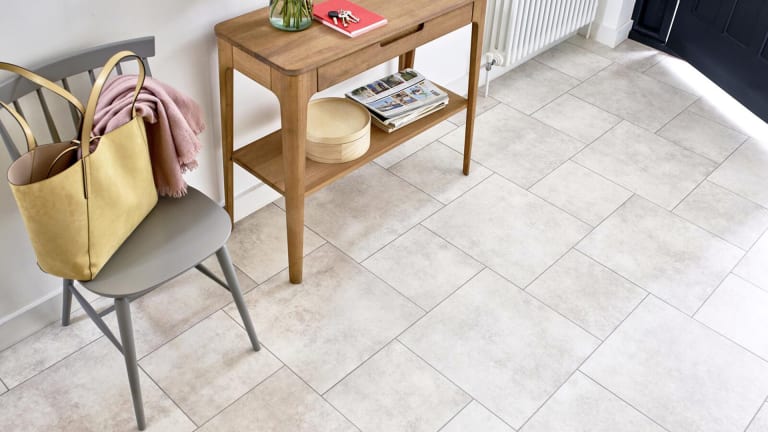 Bright and airy hallway with Amtico Stanton Stone flooring in a fieldstone pattern