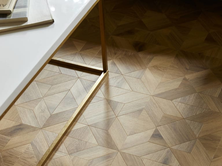 Detail of Victorian Star wood flooring with side table