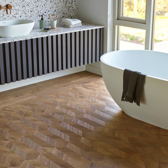 Décor's Venetian Parquet Wood Larkspur creates a mid-century feel in a bathroom space.