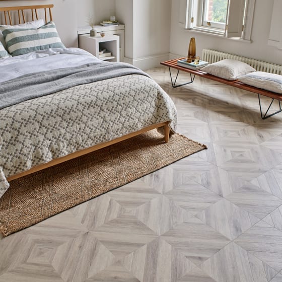 Bedroom floor features Wharncliffe Oak in Gable Parquet Small
