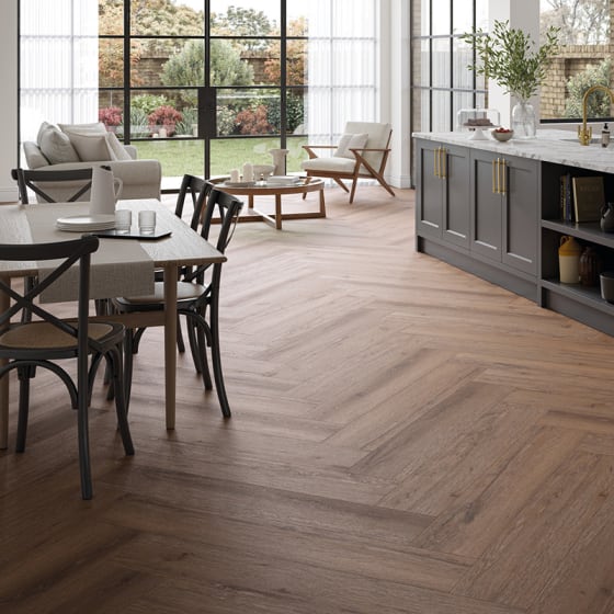 Dining room features Manor Oak in a Herringbone Plank.