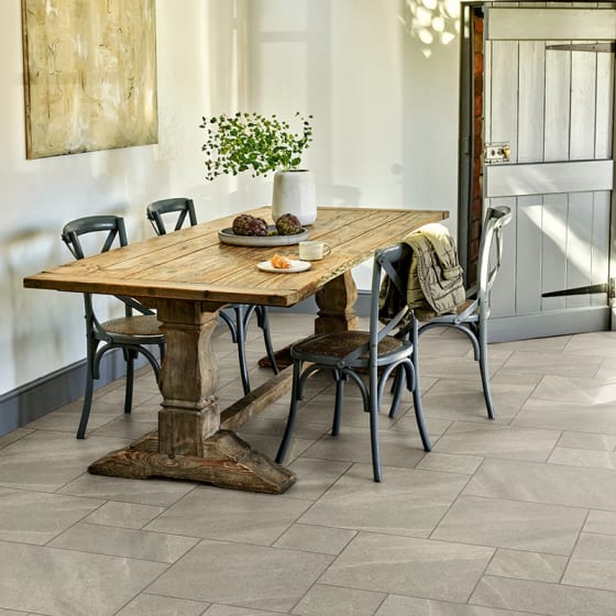 Whitley Stone in Extra Large Flagstone gives the dining room floor an eye-catching look.