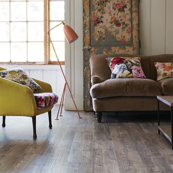 Living room floor features the smoky tones and distinctive raw grains of Harbour Pine in Stripwood.